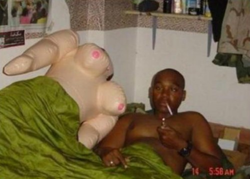 man in bed with blow up doll.jpeg