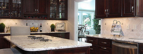 dark-brown-kitchen-cabinets-with-backsplash-tile.jpg